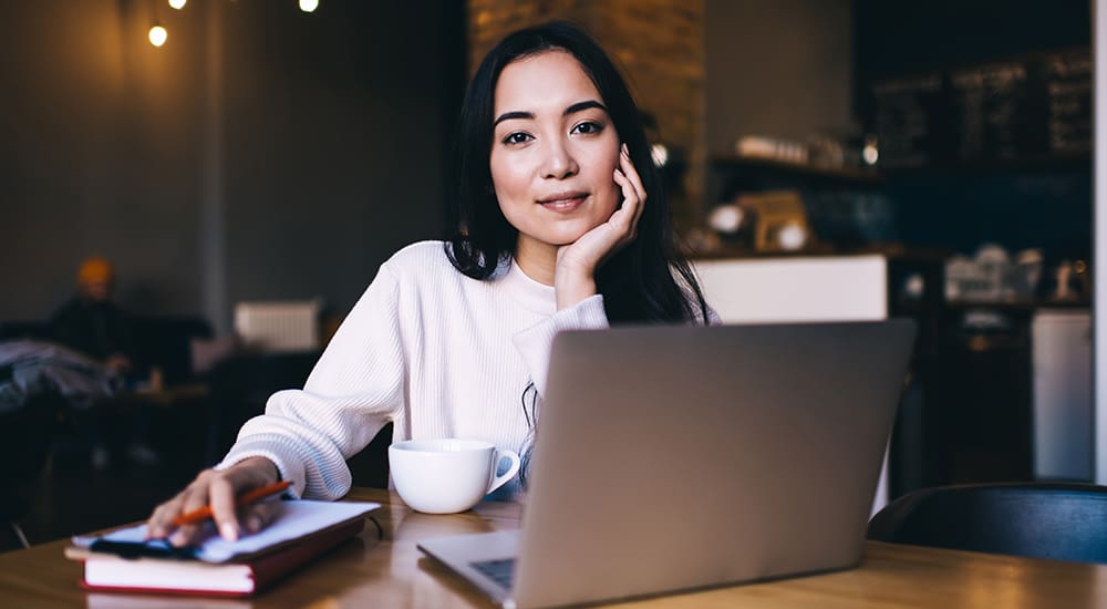 Woman at her laptop wondering what is local SEO?