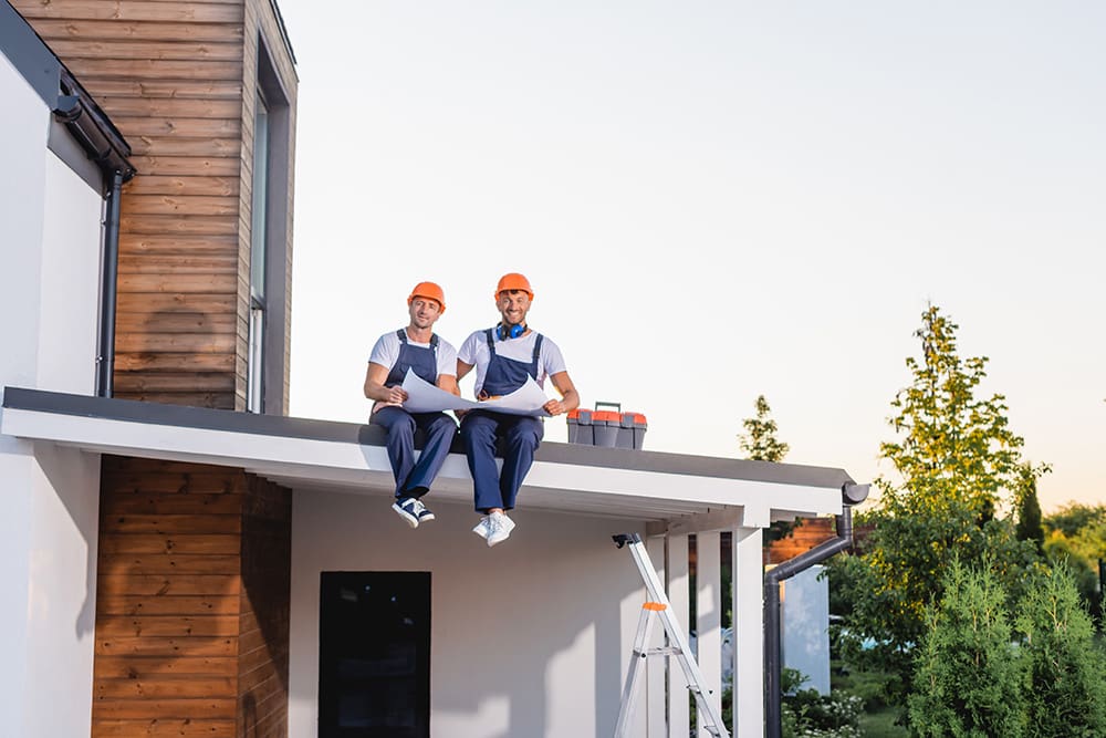 SEO for Roofers image of two roofers on a roof