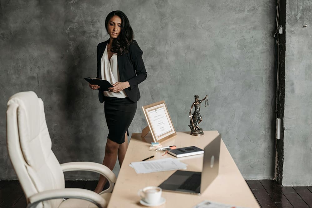 Lawyer at her desk ready to read the SEO for Law Firms Guide