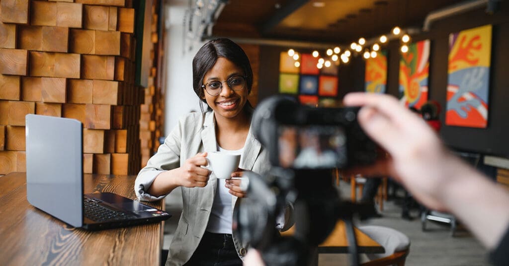 a woman on camera speaking about youtube seo strategy for faster video rankings