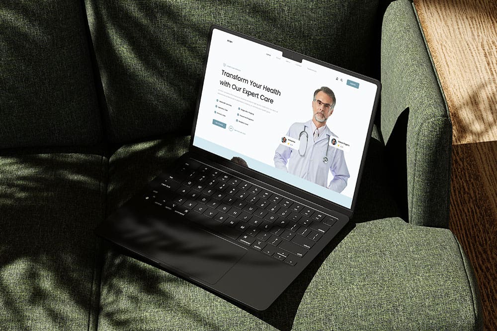 Healthcare website design laptop on a green couch