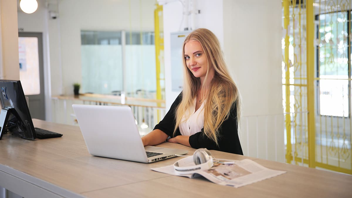 Woman at a laptop writing a blog about online pr